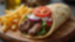 Grilled Lebanese beef kafta wrap with lettuce, tomato, onion, and garlic sauce in warm pita bread, served with crispy golden French fries on a wooden board – authentic Middle Eastern street food