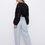 Miniaturbild: Texturierte Bluse mit Rosetten schwarz
