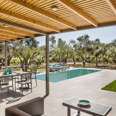 garden furniture with the view to the pool in the background