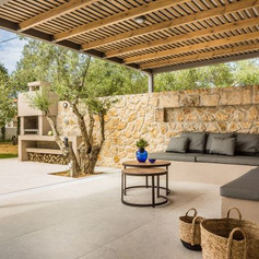 Area outside with seats made out of stone in local style