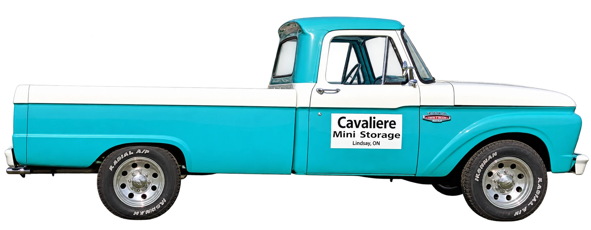 Cavaliere Mini Storage turquoise and white vintage truck in front of orange storage units