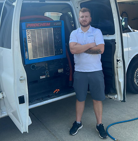 Owner of Smartpro Steam Cleaning with our service van.