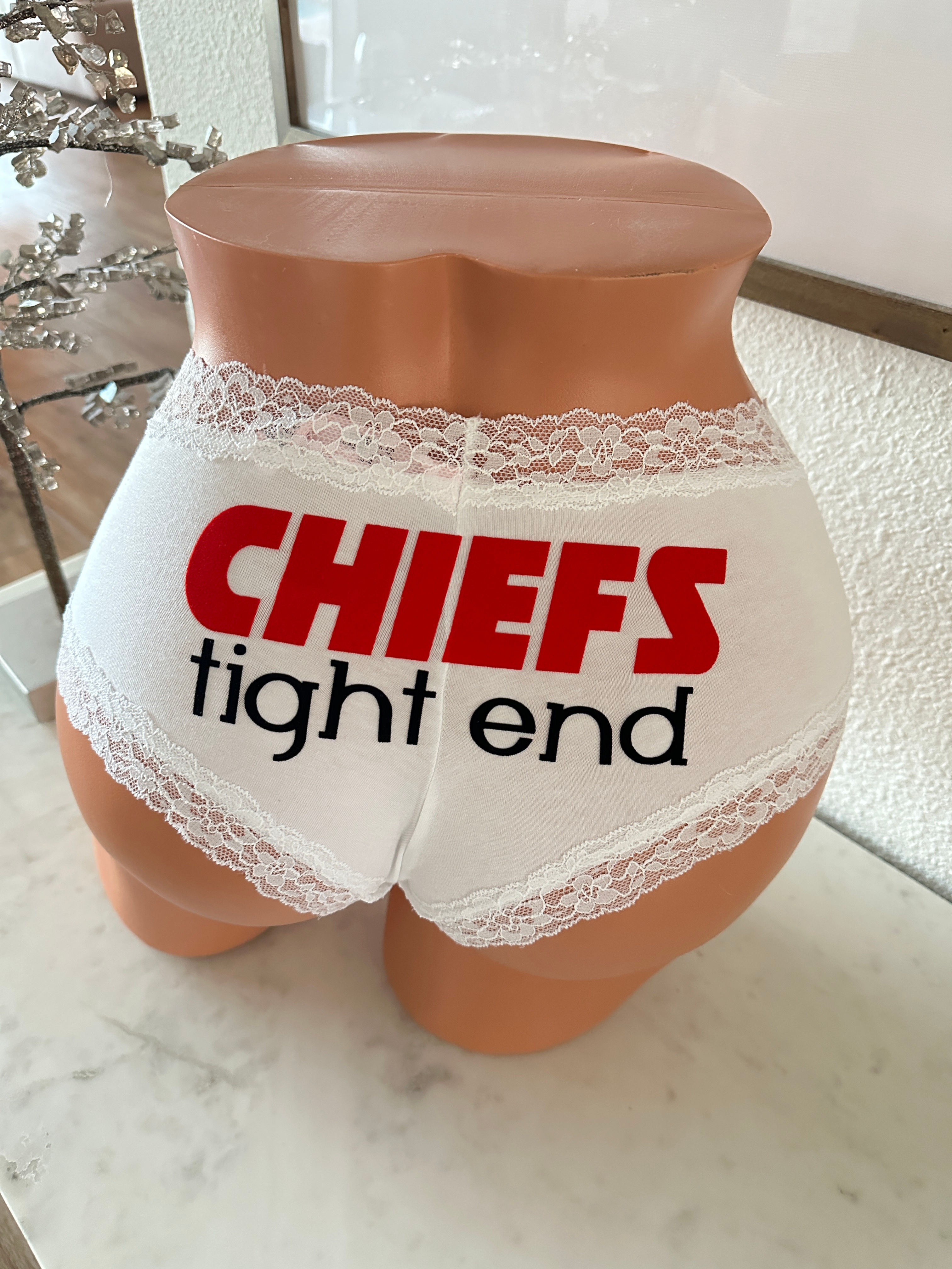 Chiefs Tight End in red and black matte – white Victoria’s Secret cheeky panties, custom on the back