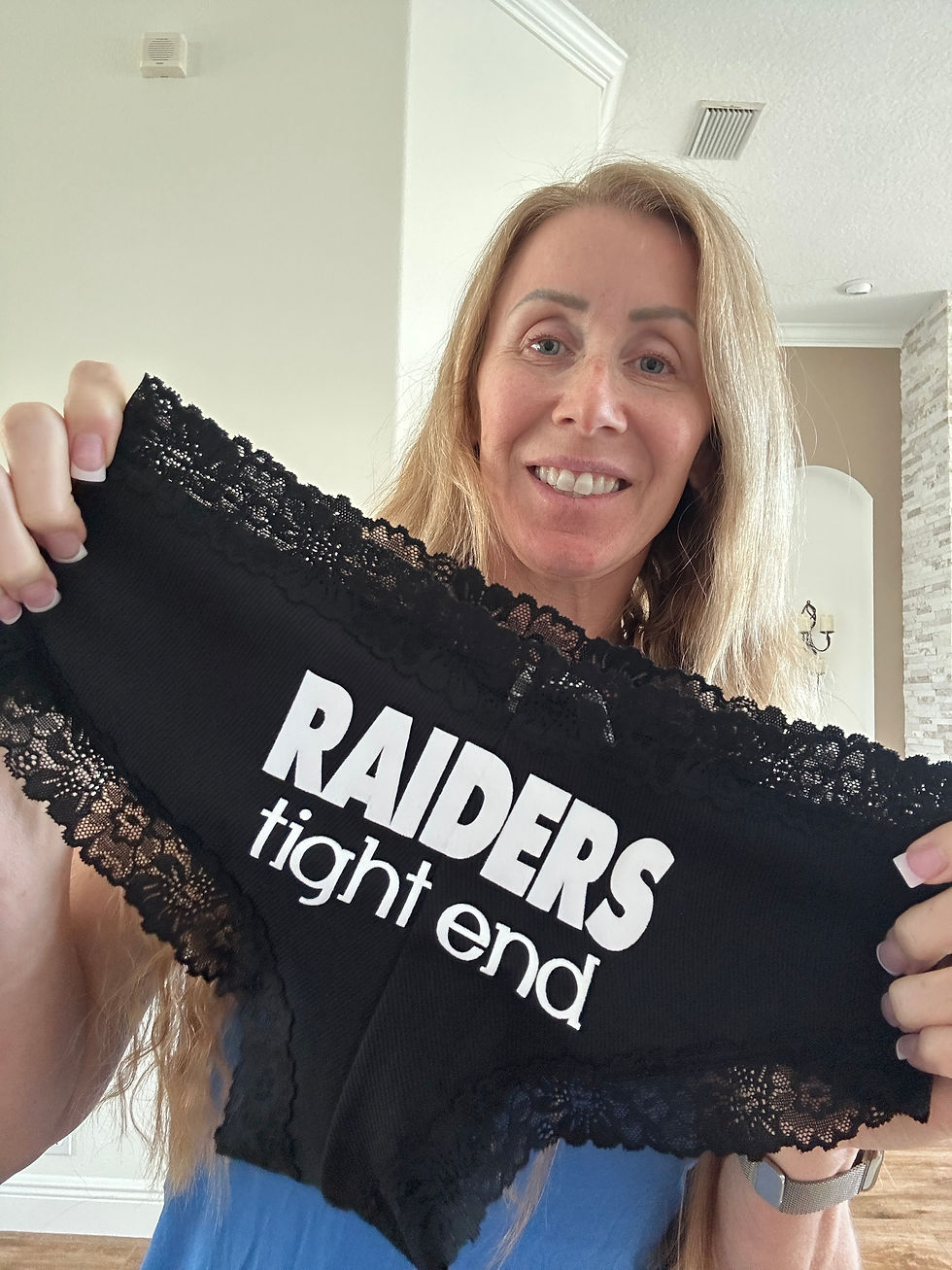 Customer holding their raiders tight end personalized football underwear