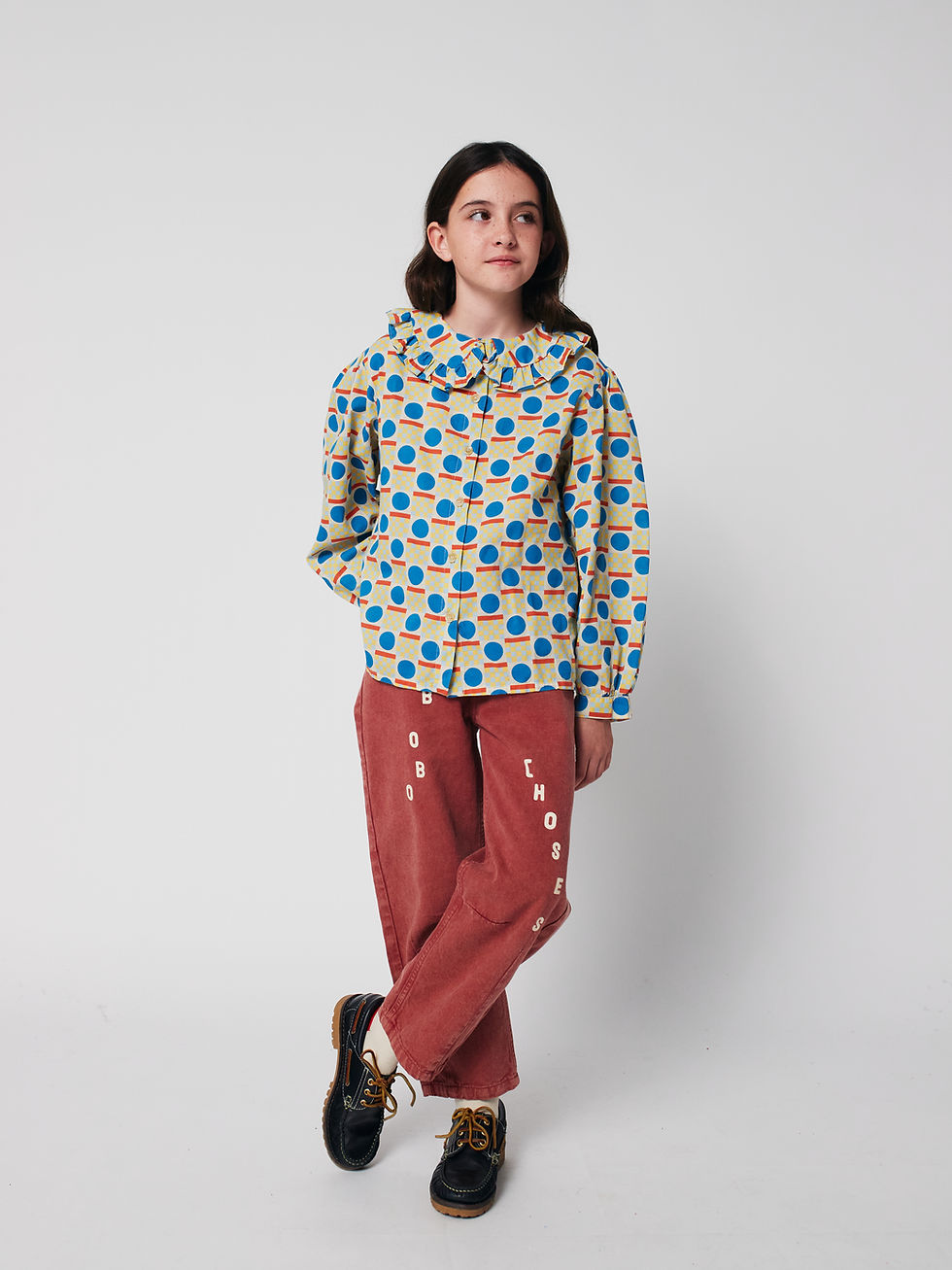 Model wearing Geometric Scacs All Over Blouse with red trousers by Bobo Choses