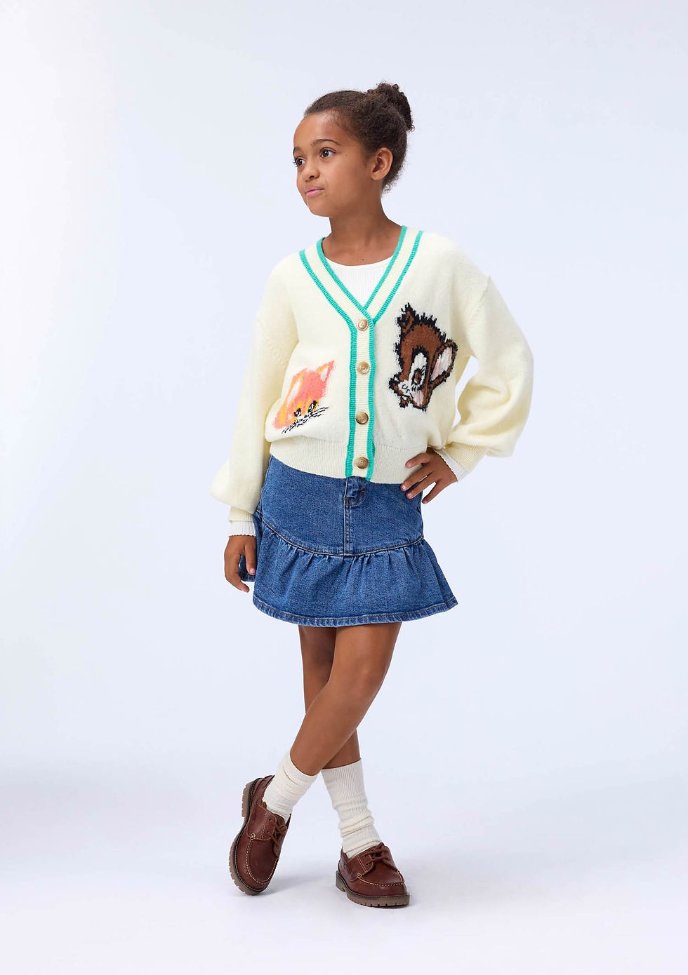 Girl wearing the Molo Bridget Skirt styled with a cozy sweater