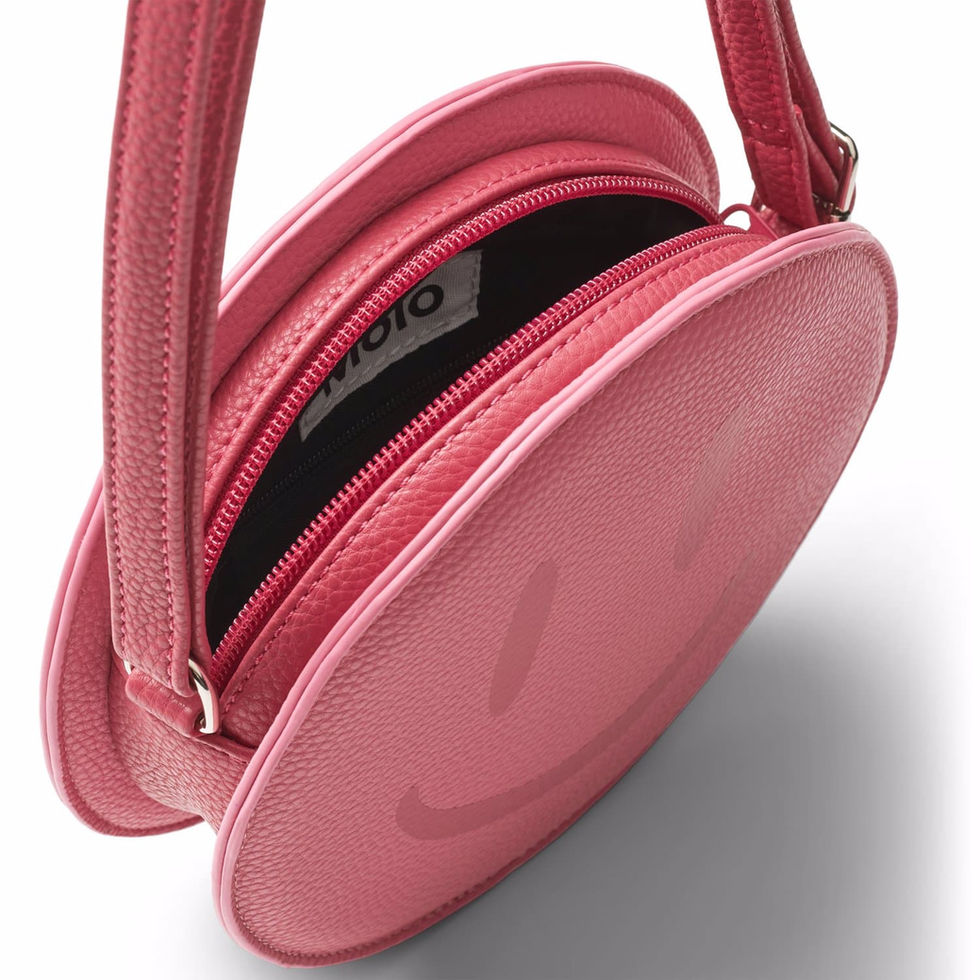 Close-up of the bag opened, showing the zipper and interior compartment.