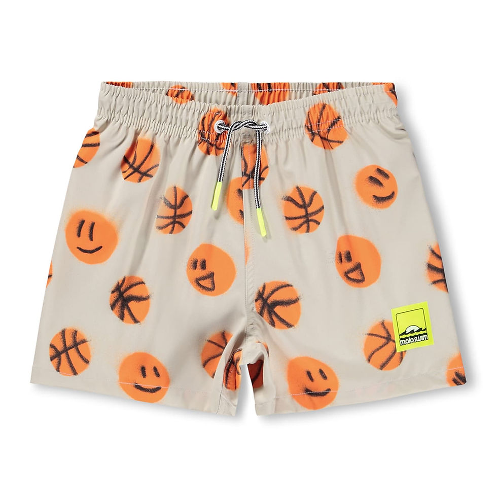 Cream children’s shorts with an all-over print of orange basketballs and smiley faces, featuring an elastic waistband with dr
