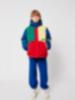 Child wearing the multicolor color block anorak front view.