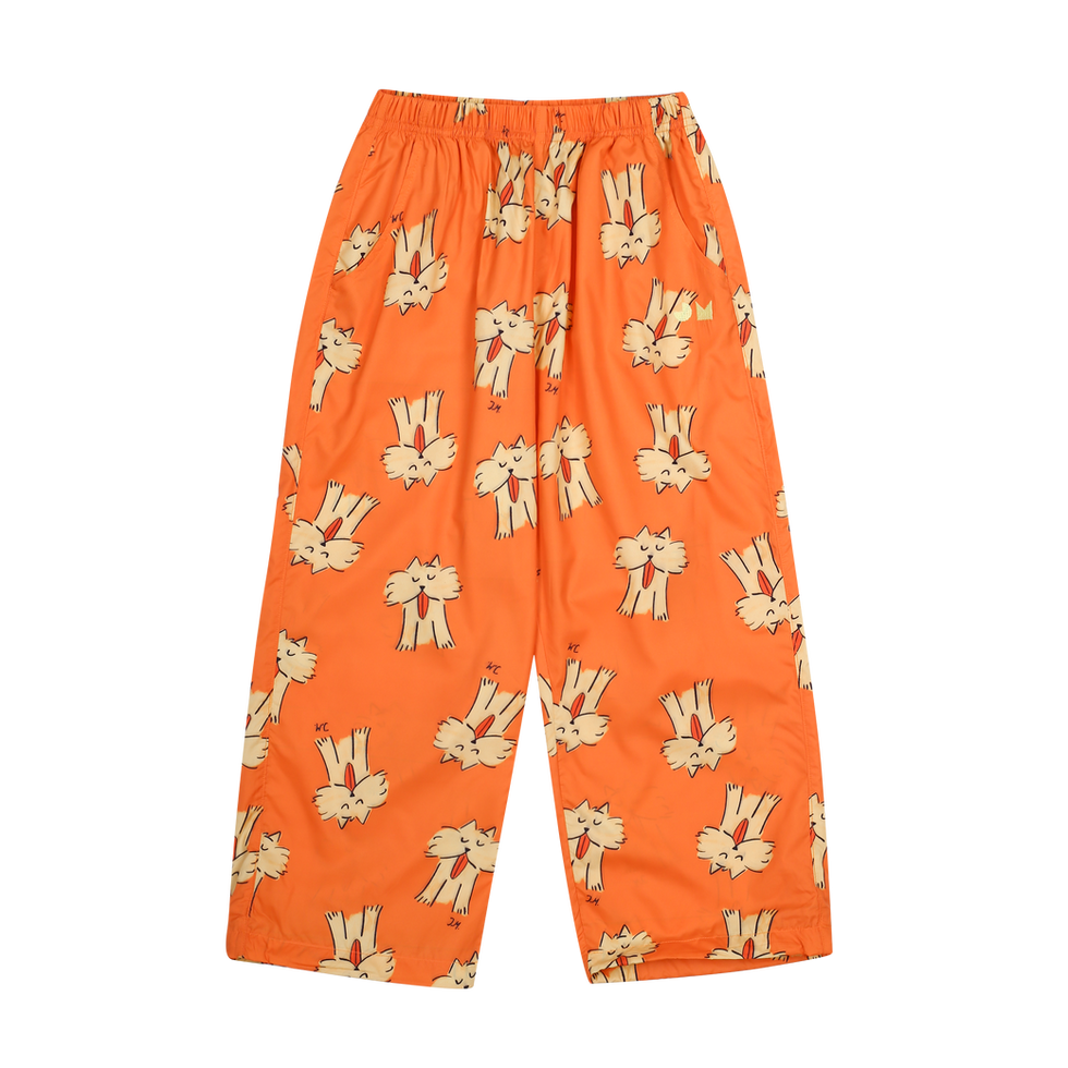 Children’s loose-fit pants in bright orange with an elastic waistband and an all-over bunny print.