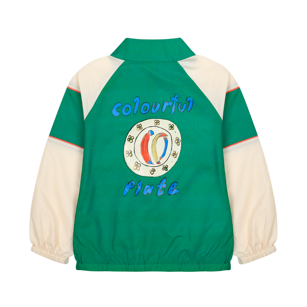 Back view of a green and beige children’s jacket featuring a “Colourful Plate” graphic on the back.