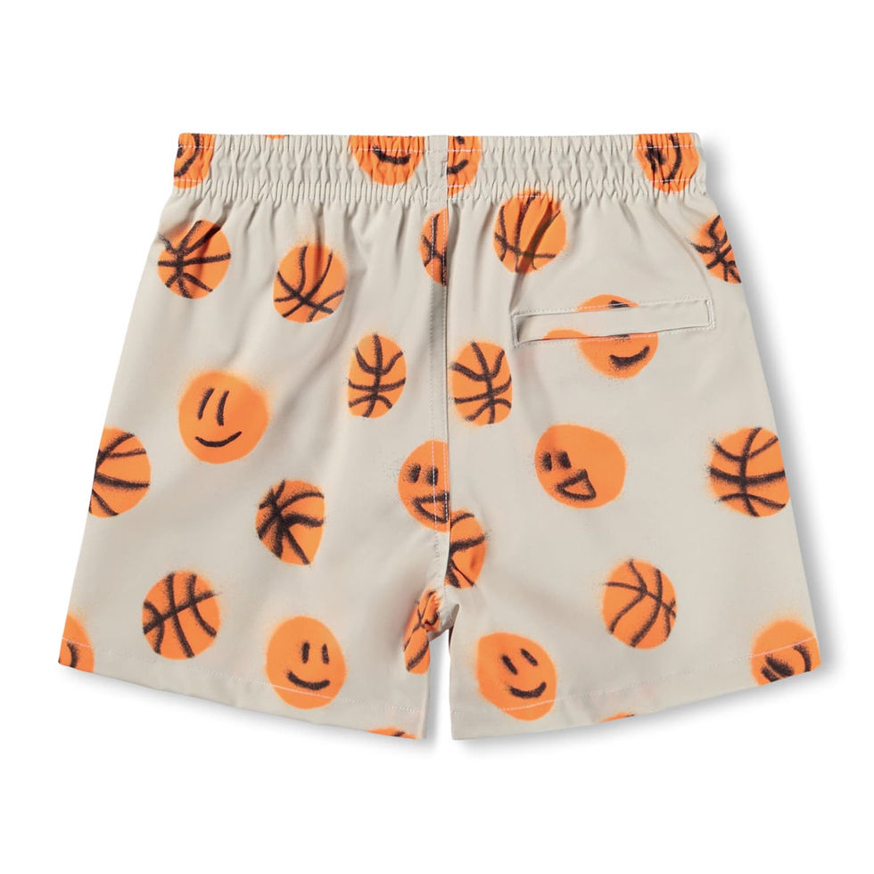 Back view of the shorts showing the all-over basketball and smiley print.