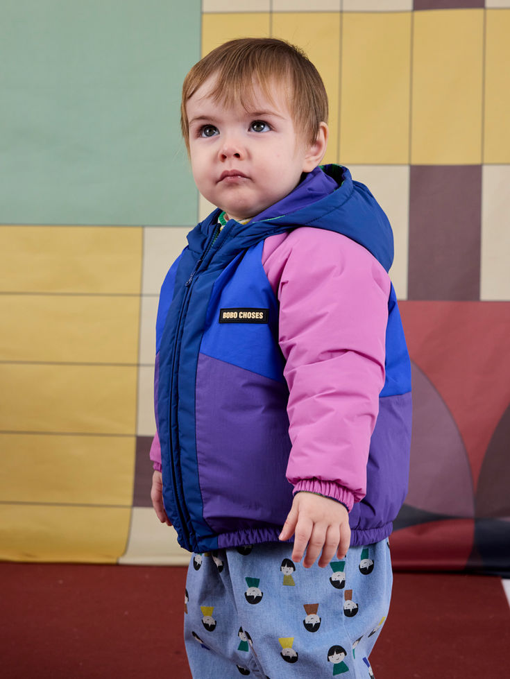 Side view of child wearing Lucky Clover Reversible Jacket multicolor side