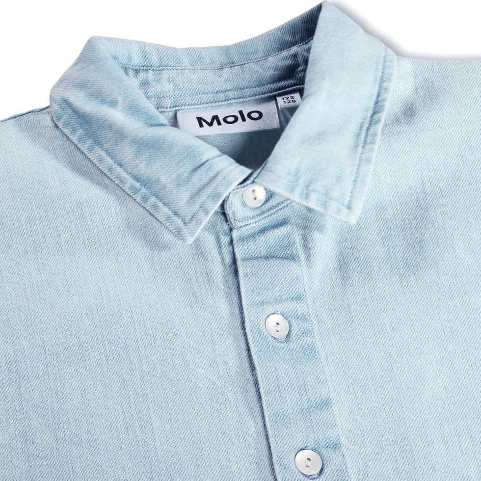 Close-up of the shirt showing collar, buttons, and fabric detail.