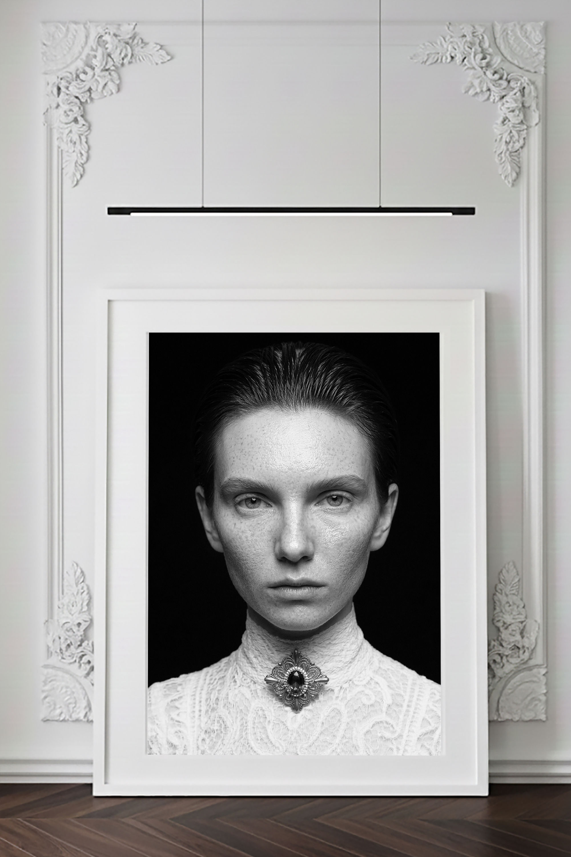 Séraphine — black-and-white fine art portrait, a direct gaze, hair drawn back, a jewel at the neckline, by HRÈ / Katarzyna K.
