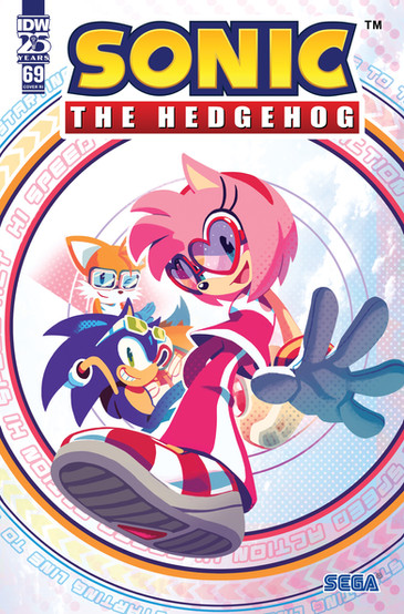 Cover of Sonic the Hedgehog #69 (Nathalie Fourdraine variant) has a large portrait of Amy as if it was drawn looking up at her. She's waving towards the reader and is wearing heart sunglasses. Behind her is Sonic lying down, and behind him Tails winking towards the reader. They're surrounded by a pink, orange, and blue ring with different text written in them.