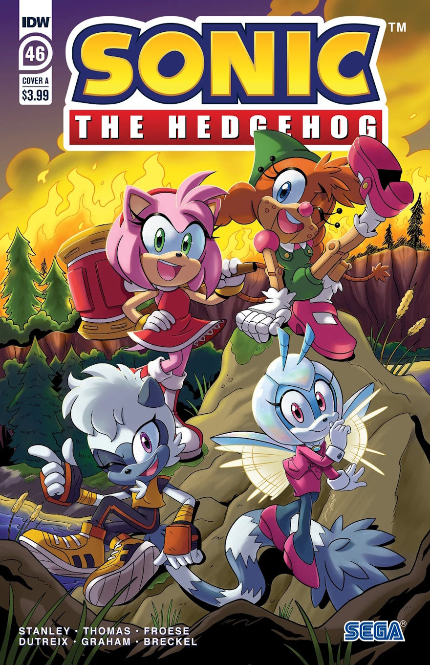 Cover of Sonic The Hedgehog #46 (Jennifer Hernandez variant) features Amy, Bell,e Jewel, and Tangle posing on a rock for a photo. Behind them is a forest on fire. They seem to be unaware at the current time as they're all smiling and seem to be having a good time.