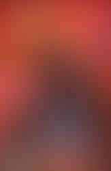 Cover of Sonic the Hedgehog X Godzilla #1 (Jack Lawrence variant) has Sonic in the foreground running away from Godzilla standing behind him turning around. All around Godzilla is a blue line that goes all around and leads up to Sonic's feet. They're in a city surrounded by skyscrapers and smoke billows around them.