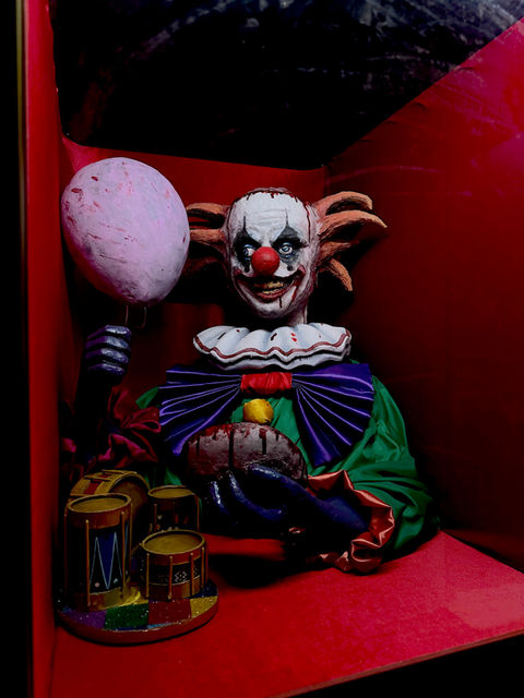 Creepy Clown Holding Cotton Candy