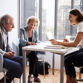 Couple Sitting with Financial Advisor_ed