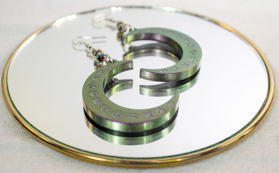 Thumbnail: Handmade Color Changing Resin Crescent Moon Earrings with Zodiac Symbols
