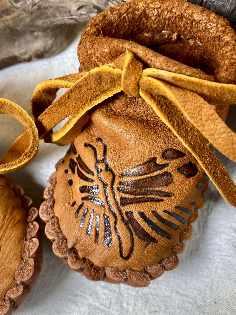 Thumbnail: hand sewn baby moccasins close up top view