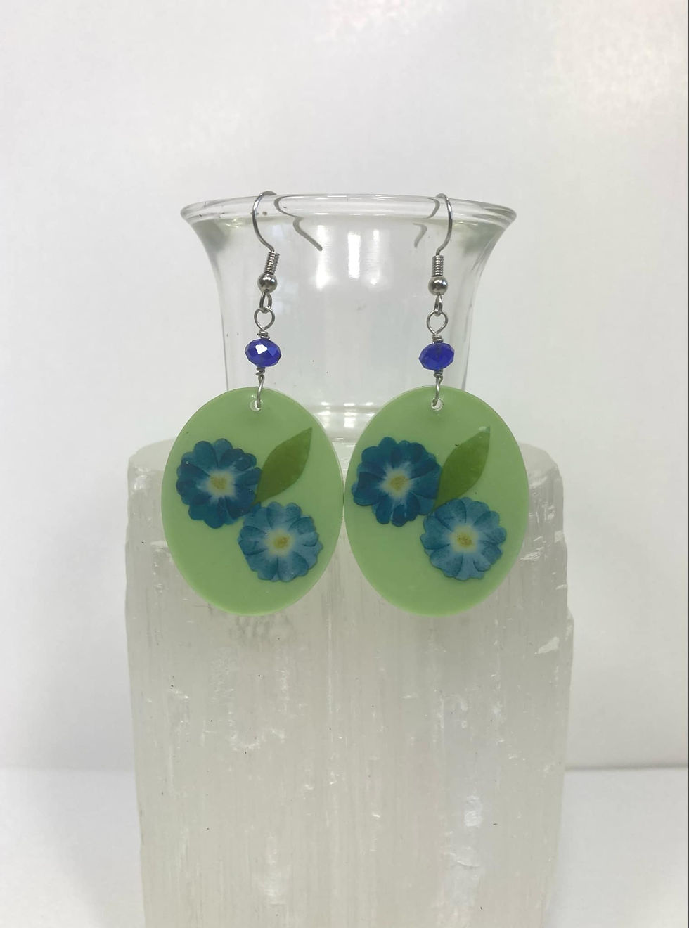 Thumbnail: Green Oval Resin Earrings with Blue Flowers