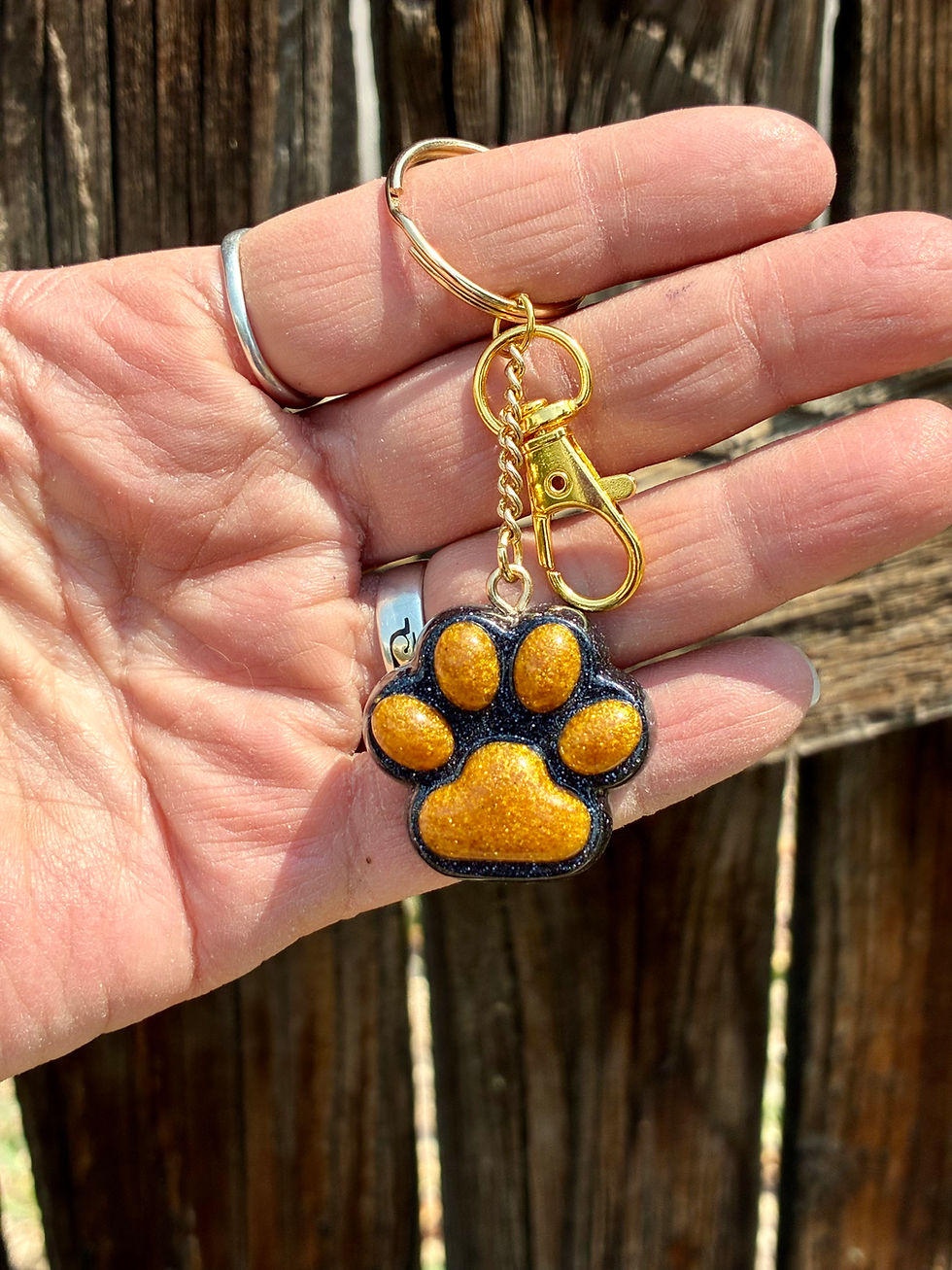 Thumbnail: Handmade Black and Gold Paw Print Resin Keychain | Dog Lover Keychain 