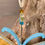 Thumbnail: blue, orange and yellow butterfly suncatcher close up of blue antennas