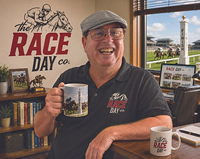 Terry Rea, founder of Race Day Co, holding a personalised horse racing mug