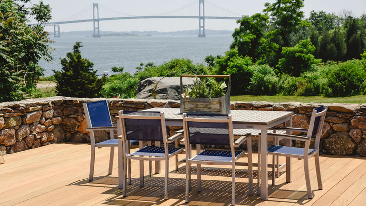 Outdoor dining terrace overlooking Narragansett Bay and the Newport Bridge — O'Connor Design Build, Rhode Island