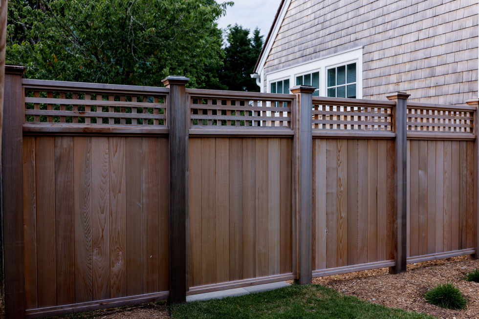 In-Town Spa Garden — Fence line below the house