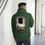 Thumbnail: Man wearing forest Lonely heart hoodie, back view, looking at red heart, 