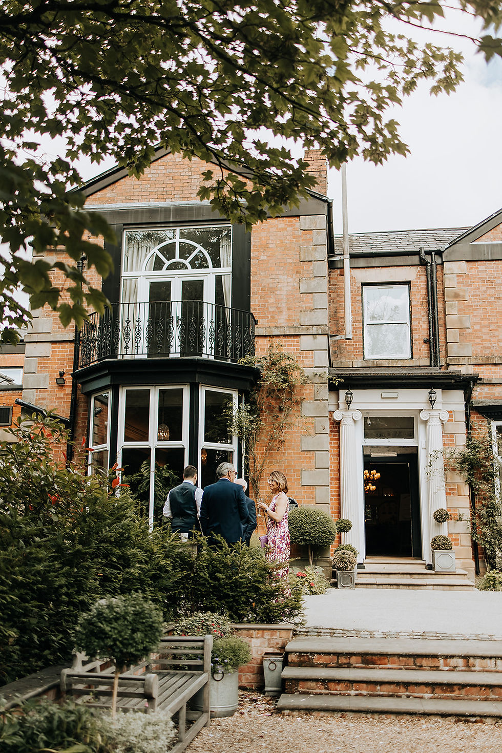 Guests chatting outside the front door of Ashfield House