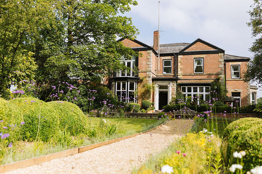 Ashfield House wedding and events venue in Standish, with the main path from The Gardens leading up to the front door. Taken by Nik Bryant