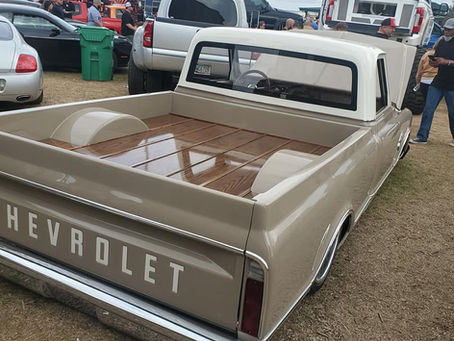 a c10 truck with shiny wood bed floor