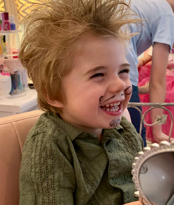 Little boy having fun in salon
