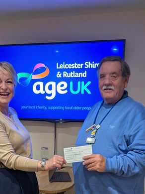 Presenting our donation to Age UK Leicester Shire & Rutland