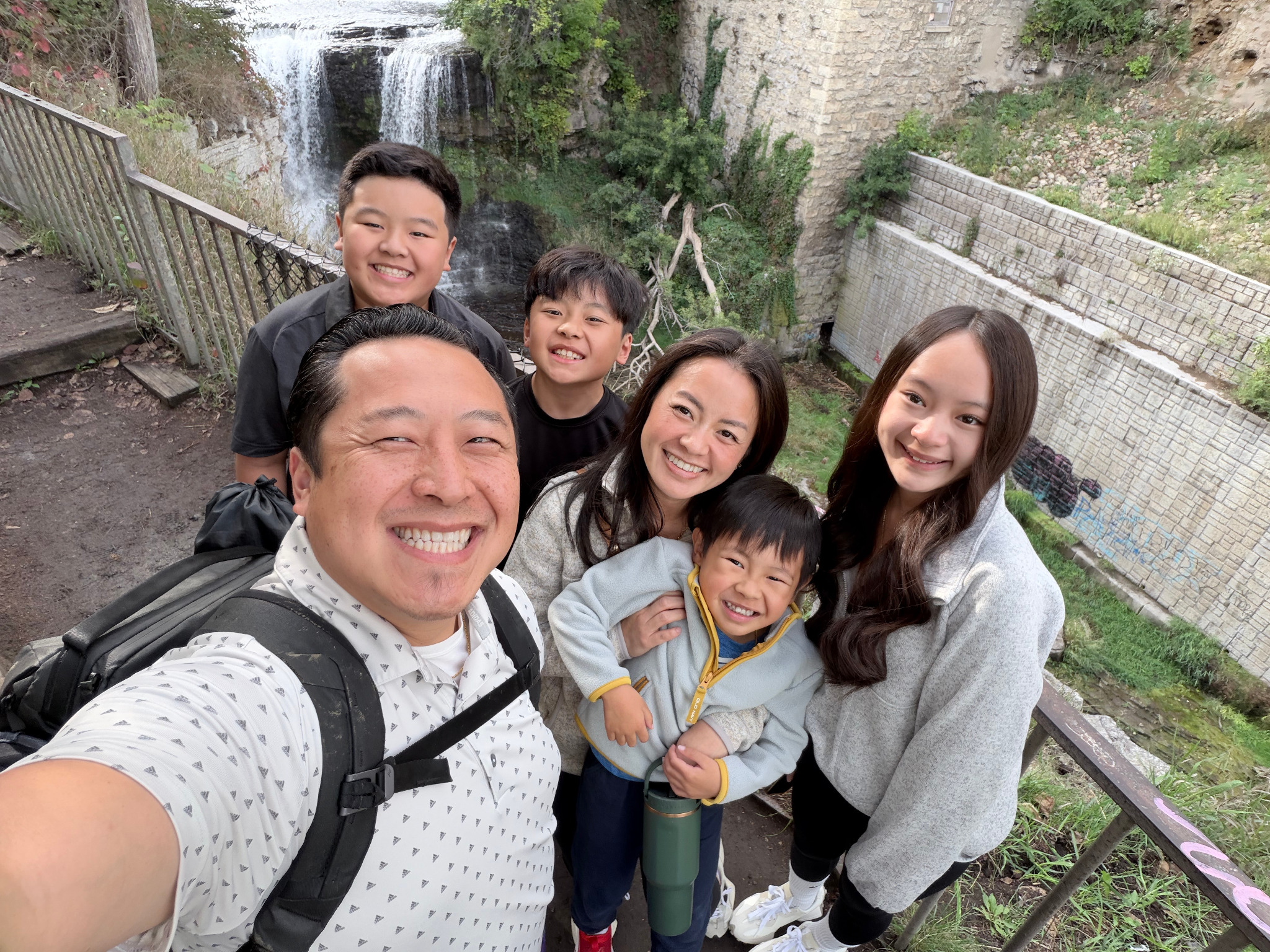Chonburi with his family visiting a waterfall