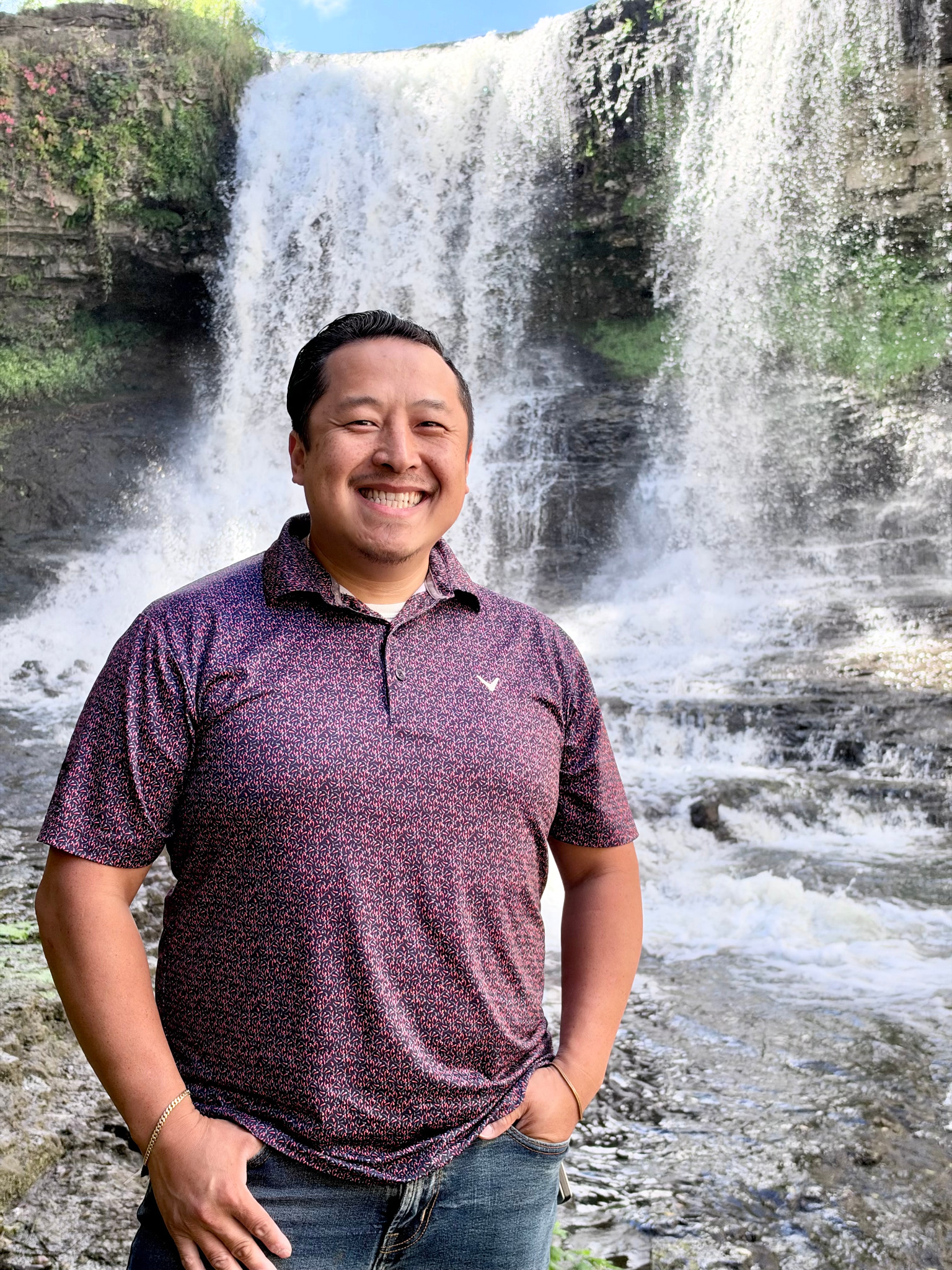 Chonburi outdoors in front of a waterfall
