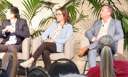 Panel discussion in a tropical setting.png