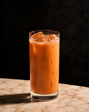 Thai Tea Rum Cocktail made with Choeng Doi Blanc rum, served in a highball glass