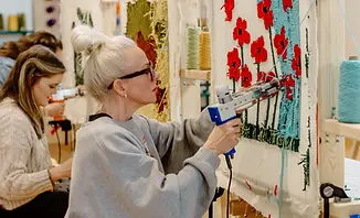 Craft for Team rug tufting workshop in the Bay Area – hands-on team building activity where guests design custom rugs using t