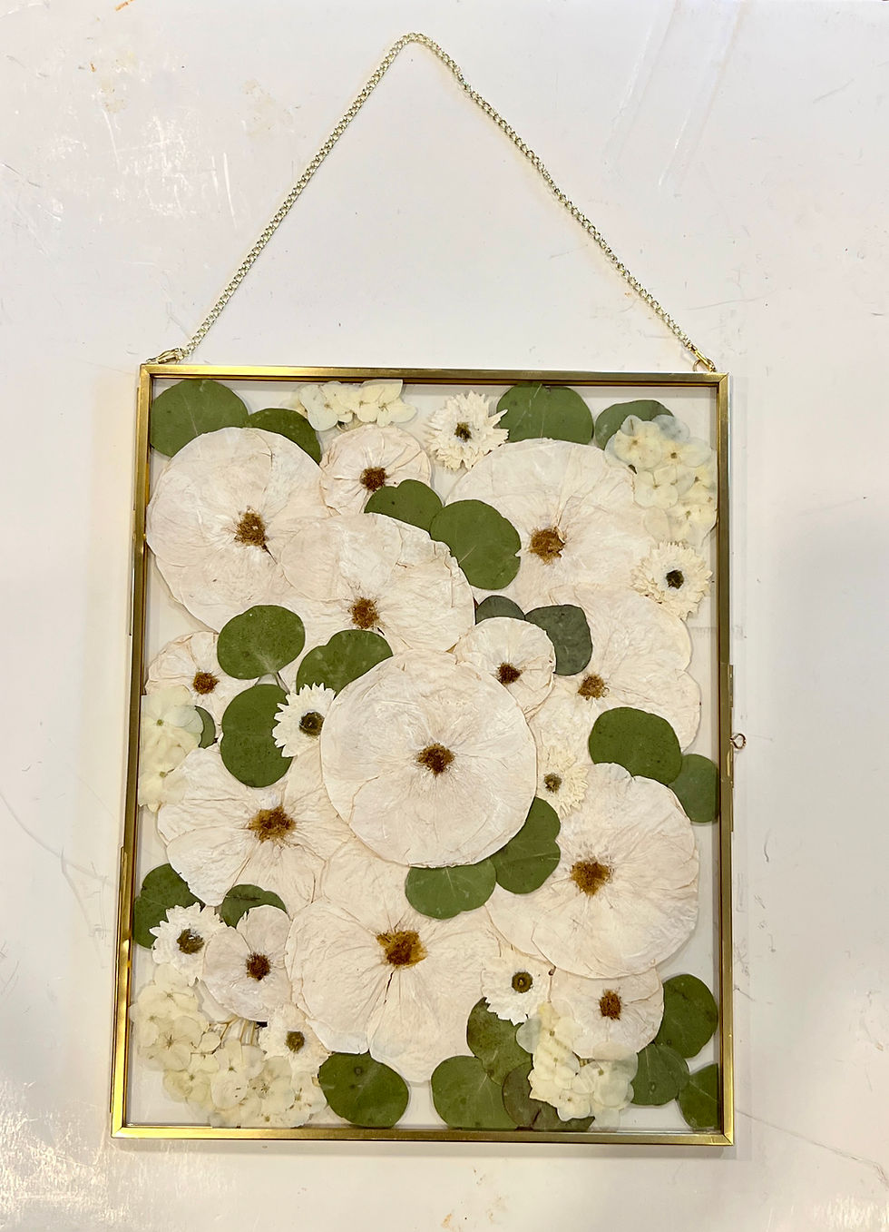 Thumbnail: Custom Pressed Floral Brass Frame With Chain