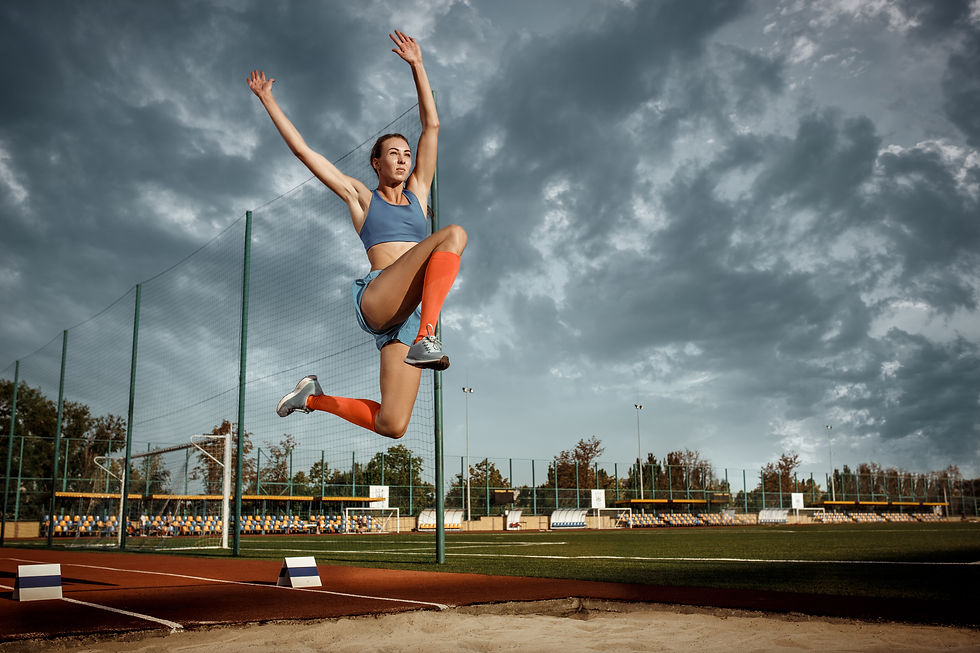 female-athlete-performing-a-long-jump-during-a-com-2024-10-18-05-38-12-utc.jpg