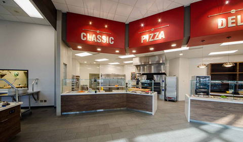 SNU Dining Facility Renovation Signage over Food Serving Areas. Large Signs Read "Classic", "Pizza", and "Deli."