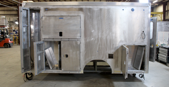 Driver side view of Muksogee #2657 Type III ambulance in welding and fabrication.