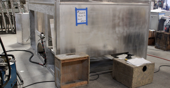Front curbside corner view of Burke #2665 in beginning welding and fabrication.