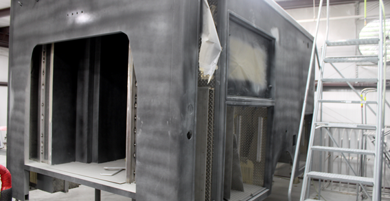 Front driver side corner view of Muskogee #2655 in paint and body prep.