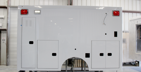 Driver side view of Type I ambulance for Liberty #2571 painted.